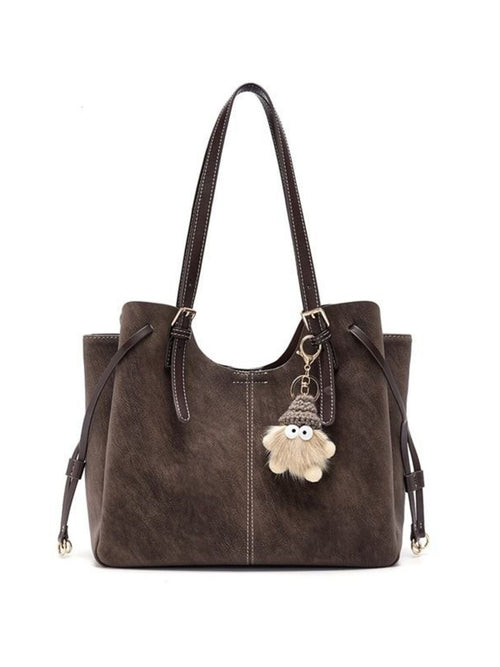 Adjustable Straps Shoulder Bag in brown PU faux leather with a fluffy pom-pom keychain