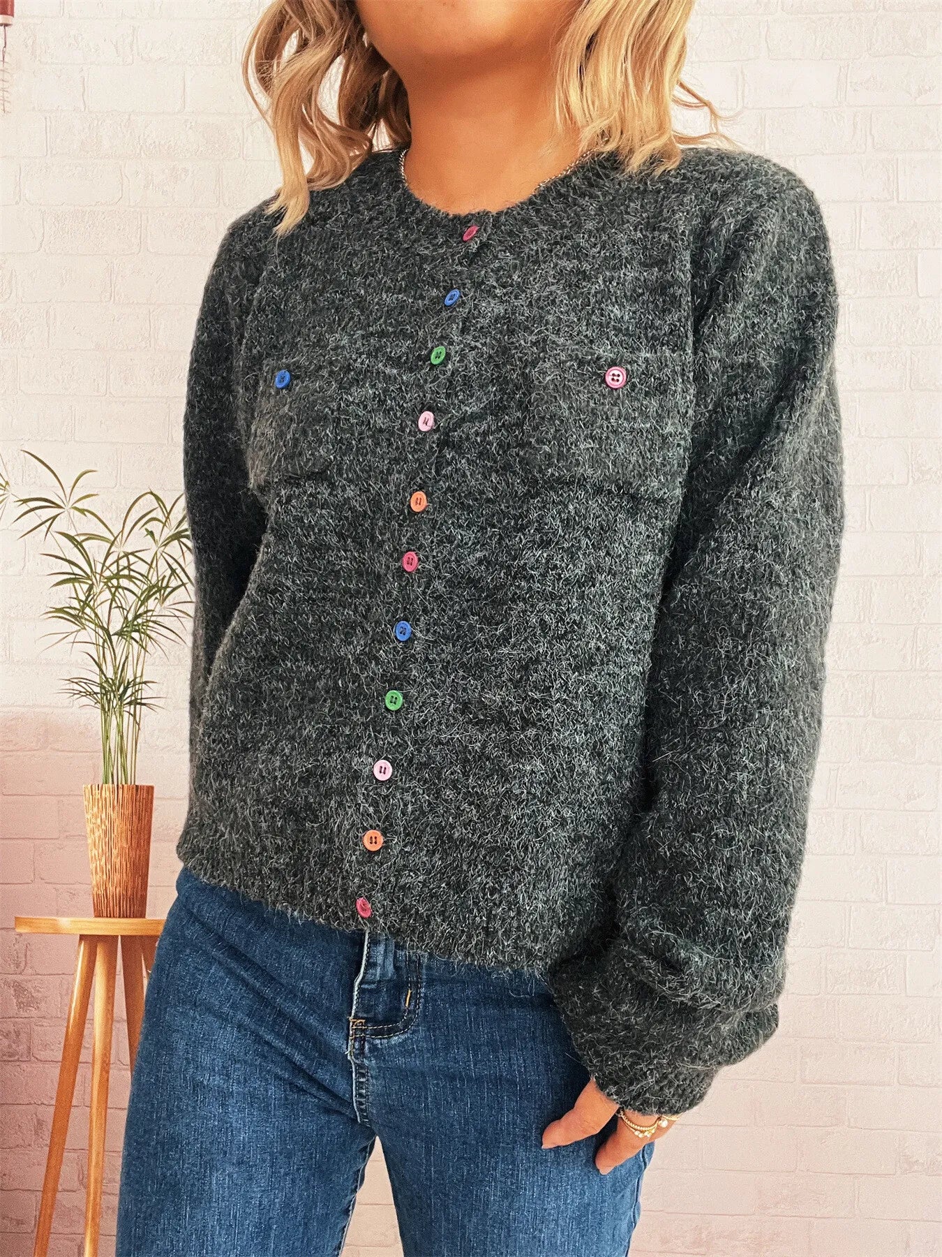 Dark gray button-up cardigan with multicolor buttons and textured knit, long sleeves