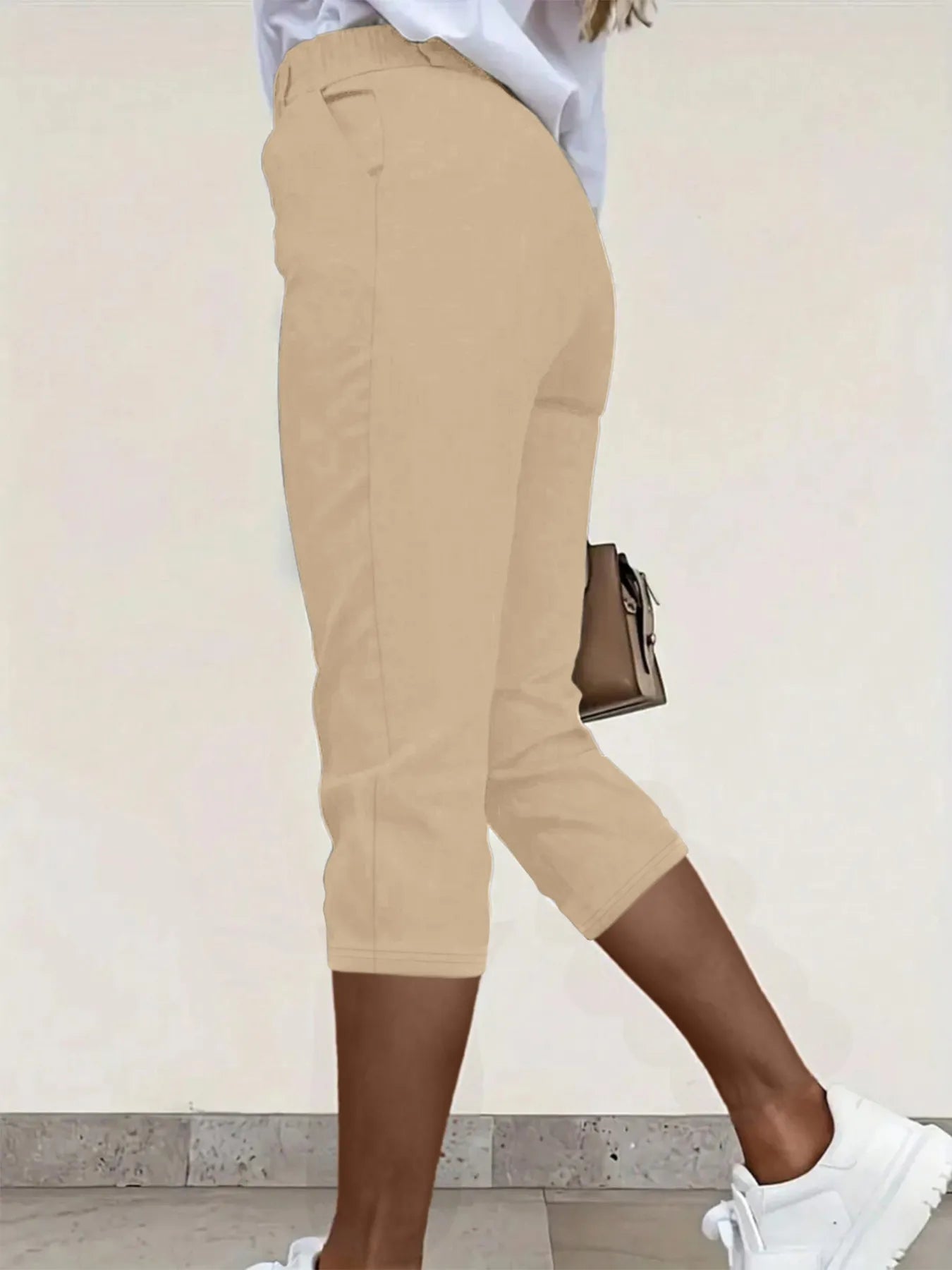 Pleated detail pants with pockets, tan, side profile, cropped ankle length