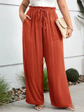Rust high-waist wide-leg drawstring pants with elastic waistband and side pockets