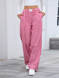 Plaid wide-leg casual pants in red and white, elastic waist, loose fit.