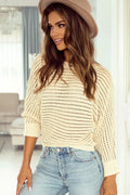 Cream openwork sweater with round neck and long sleeves, small cutout knit
