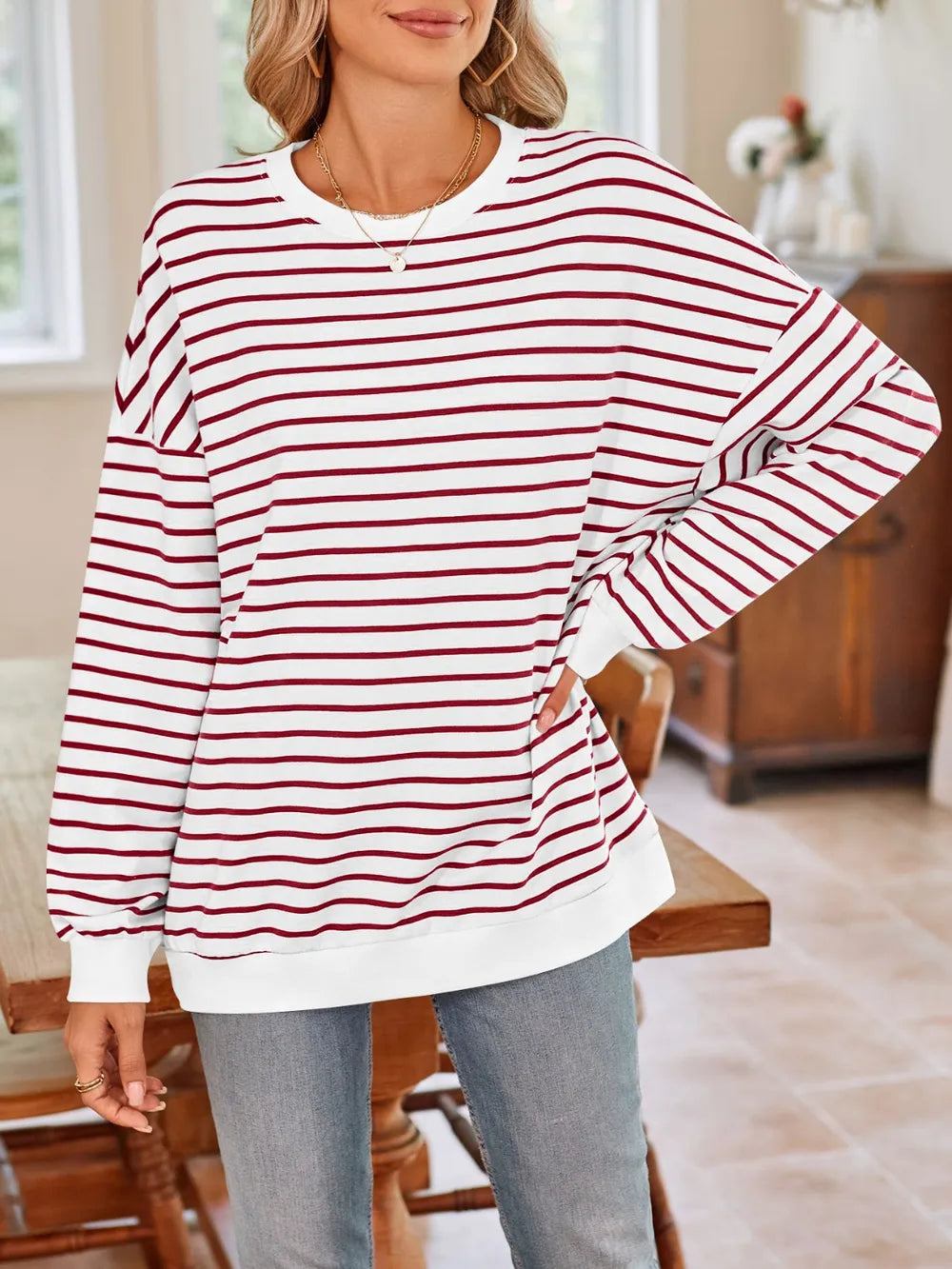 Striped long-sleeve sweatshirt with round neck, red-and-white horizontal stripes, relaxed fit