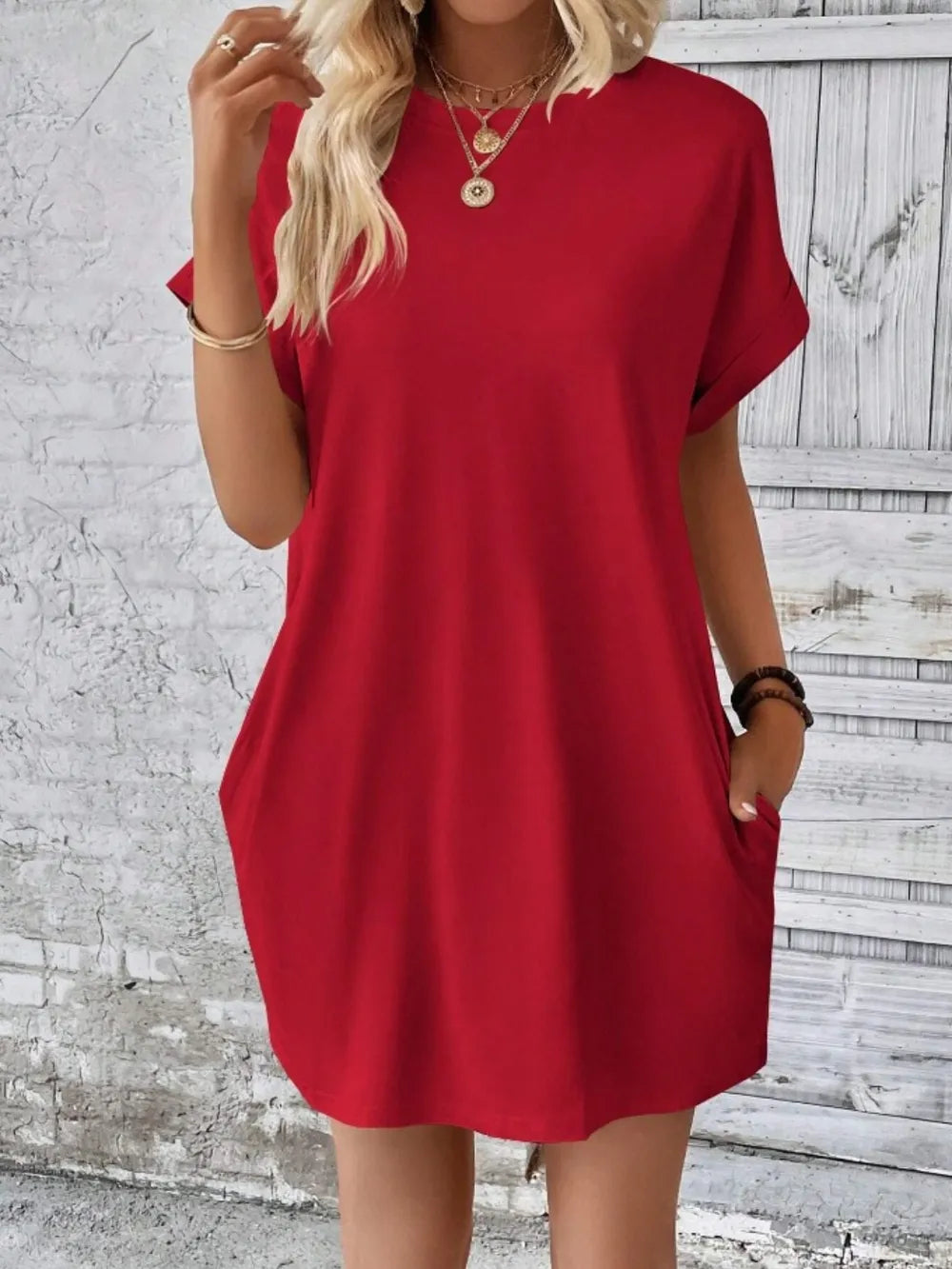Deep red pocketed round-neck short-sleeve dress with relaxed fit and side pockets