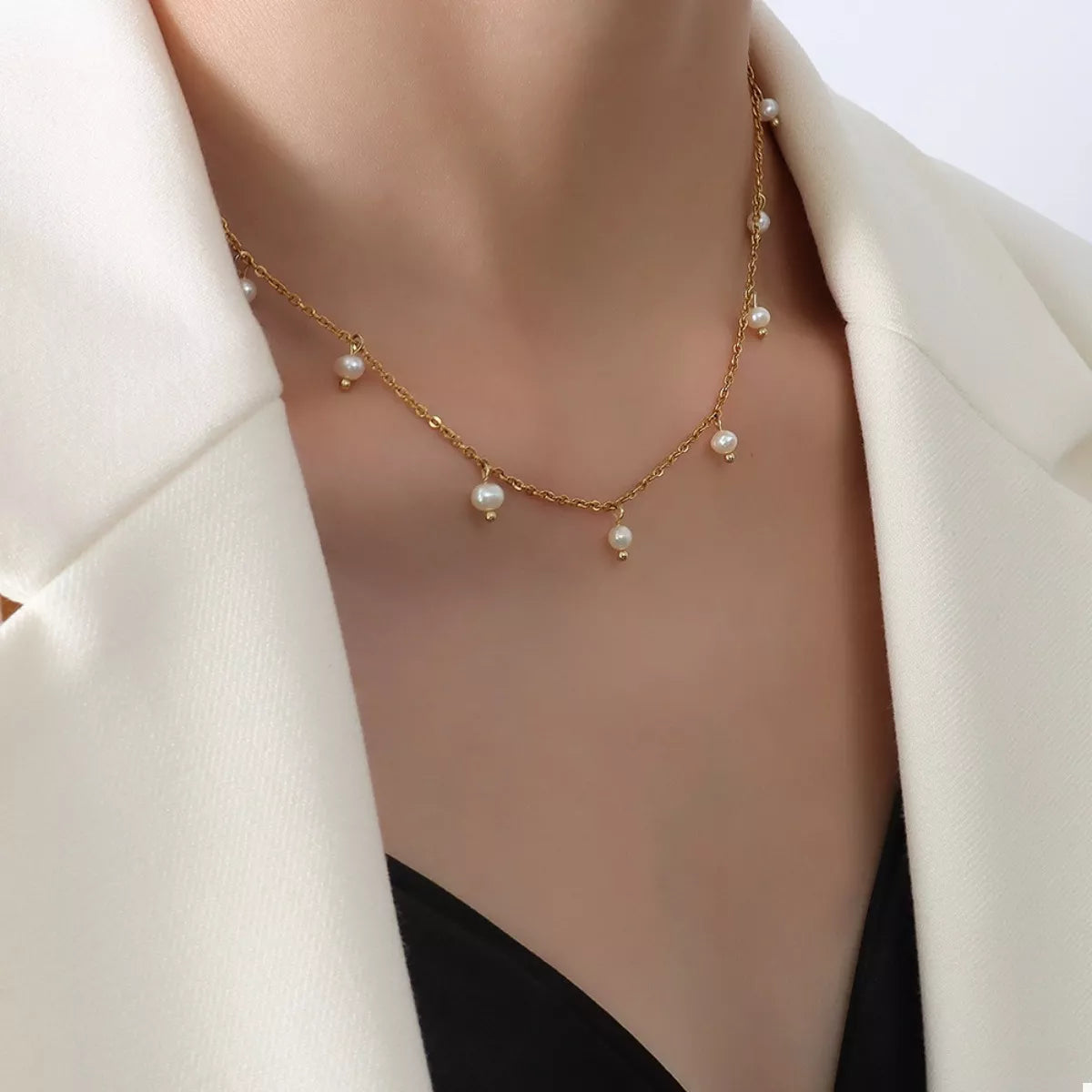 Gold-plated freshwater pearl necklace with a few pearls spaced on a fine chain
