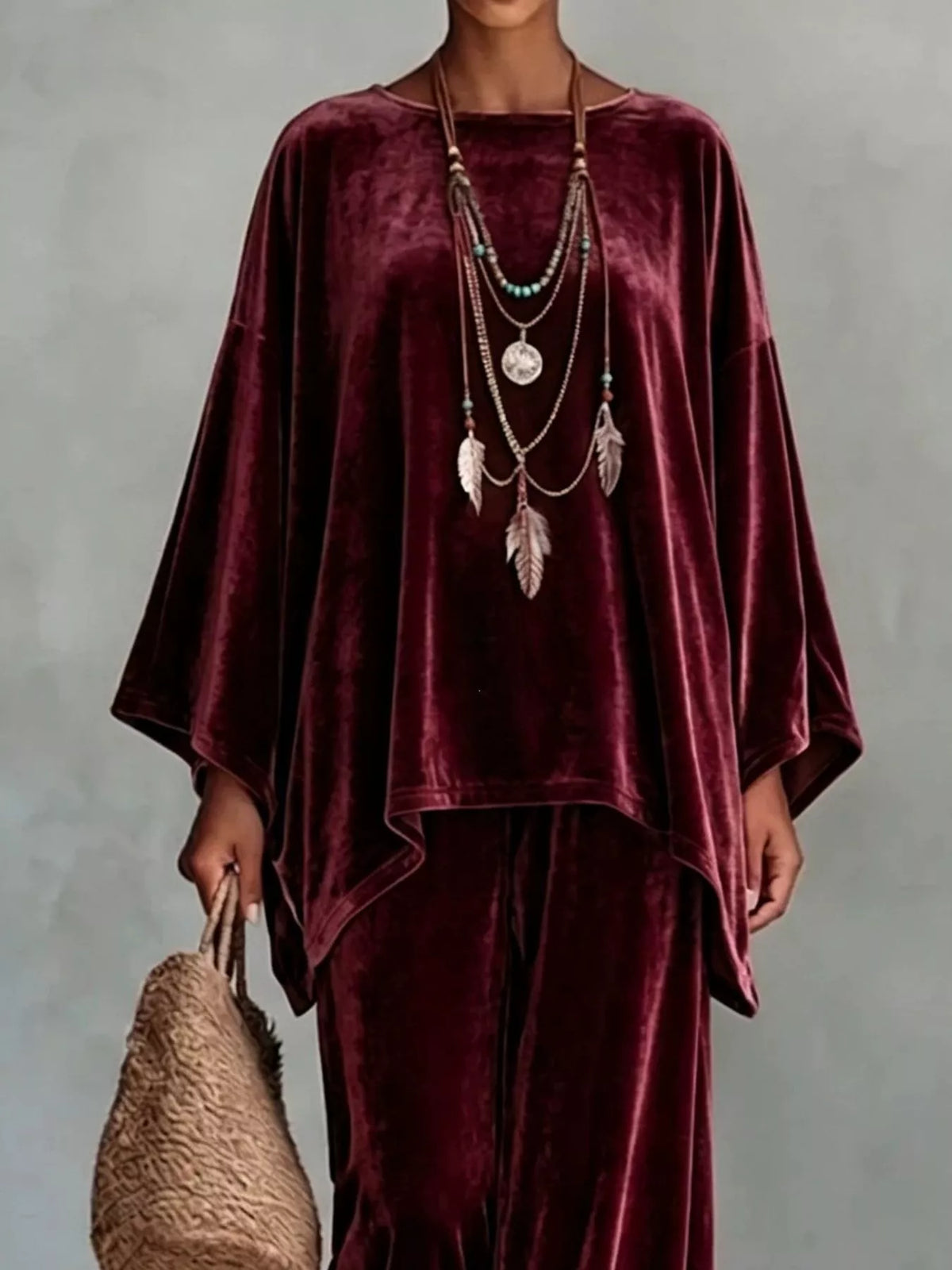 Burgundy velvet wide-leg pants set with asymmetrical drape top and wide sleeves