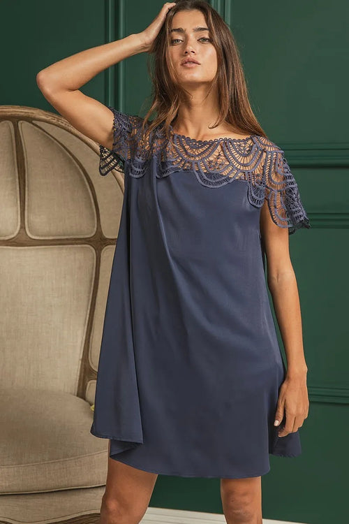 Deep navy dress with crochet lace neckline trim and short cap sleeves, knee length