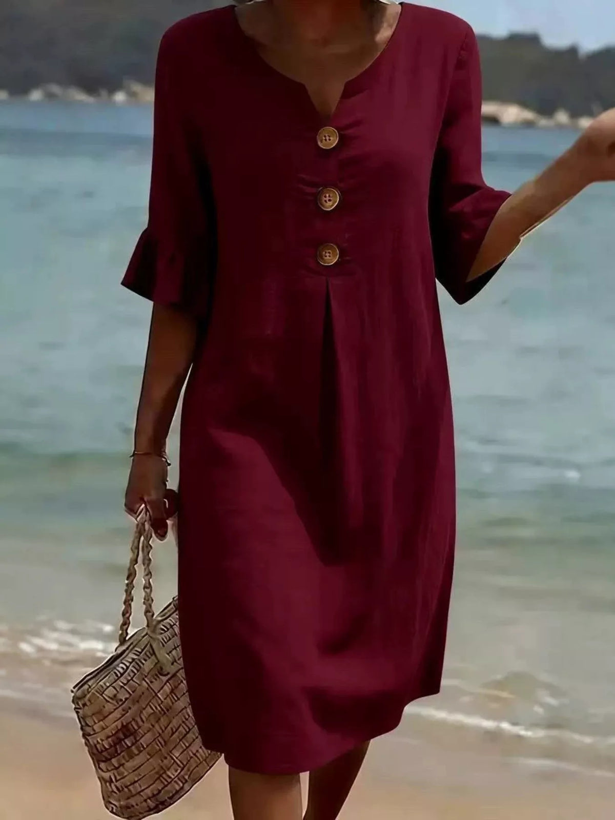 Burgundy V-neck button-front midi shift dress with ruffle sleeves and three wood-tone buttons