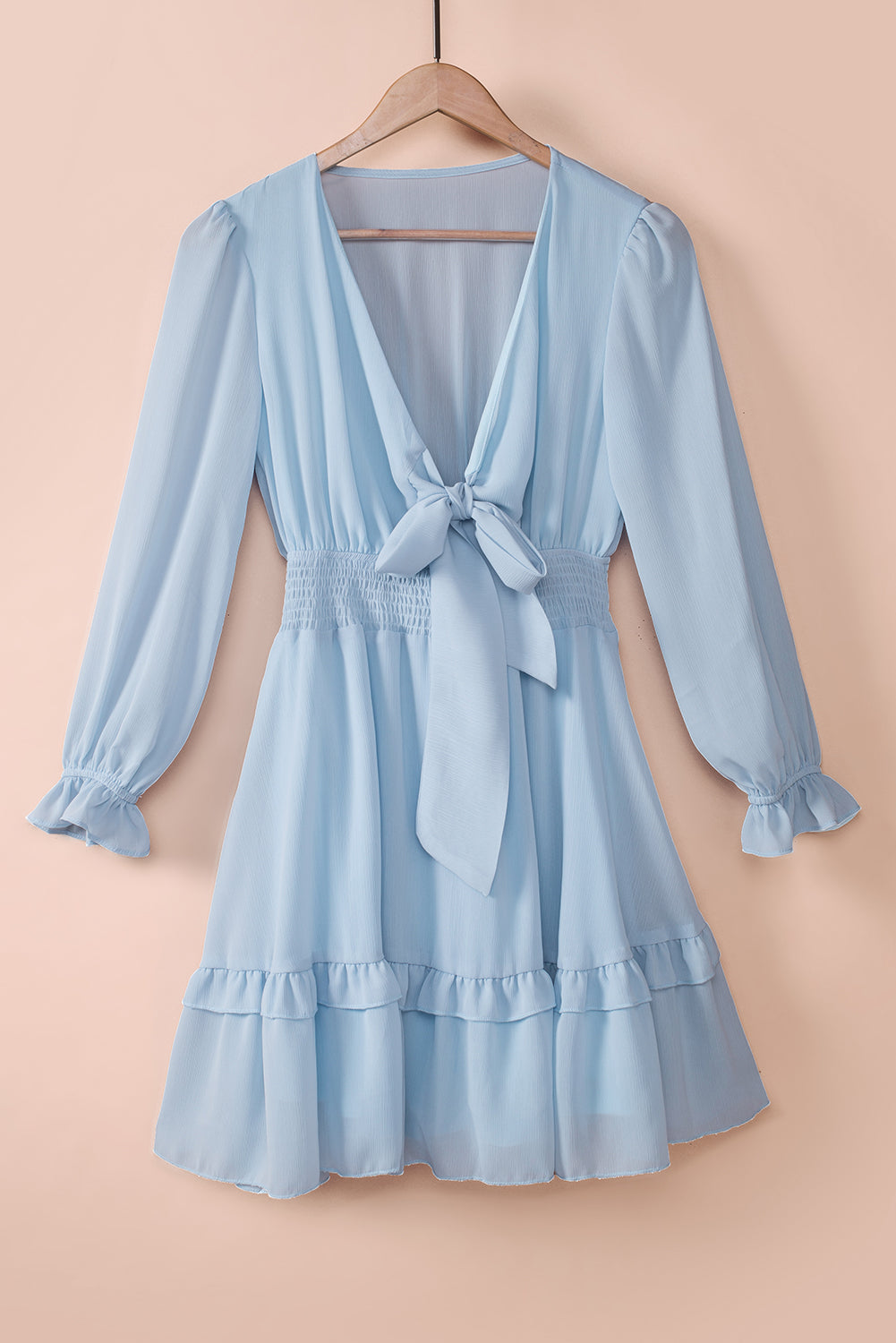 Sky blue smocked-waist flounce dress with tied V-plunge neckline and tiered hem