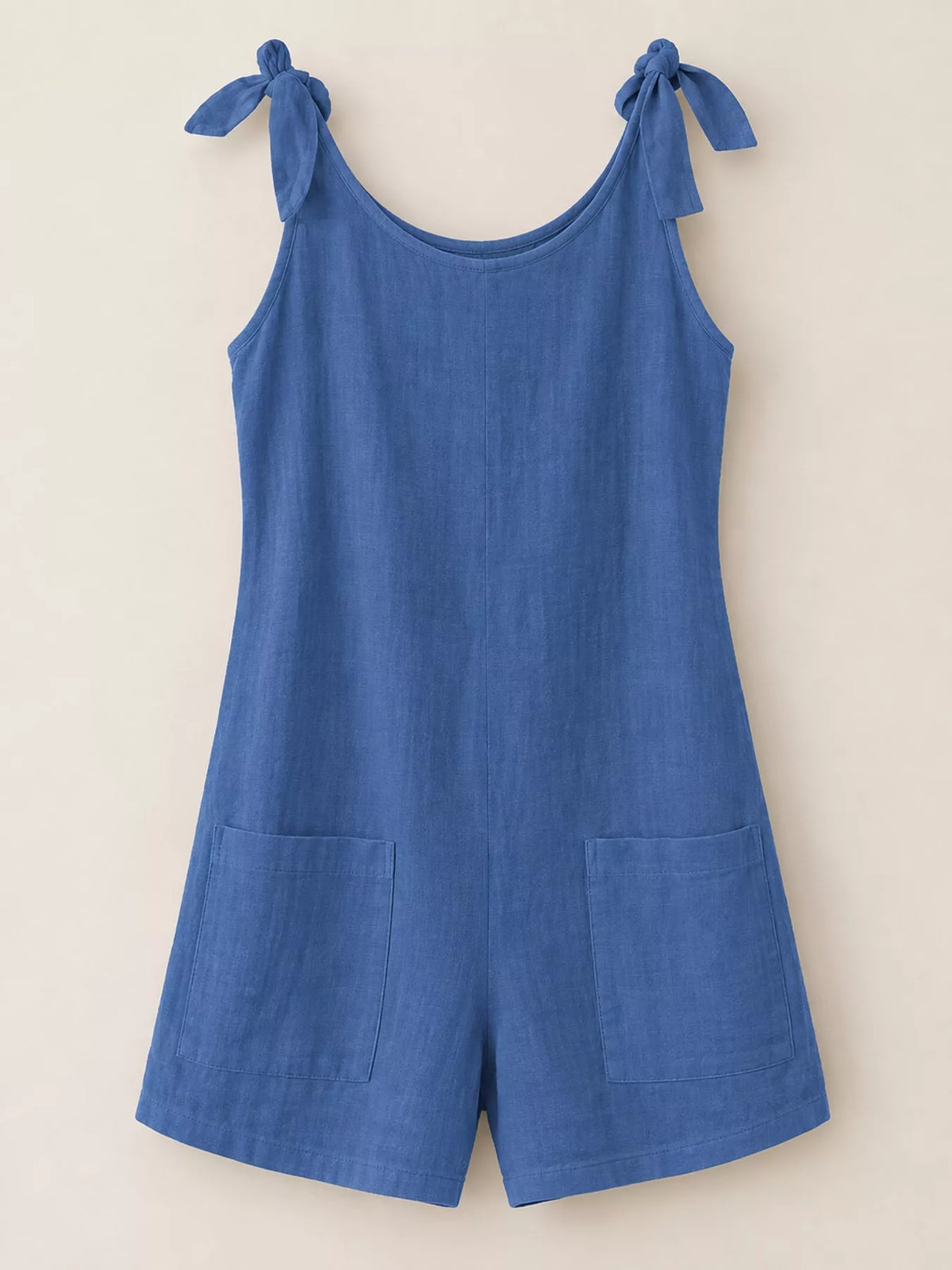 Sky blue tie-shoulder bow romper with front pockets and wide-leg shorts