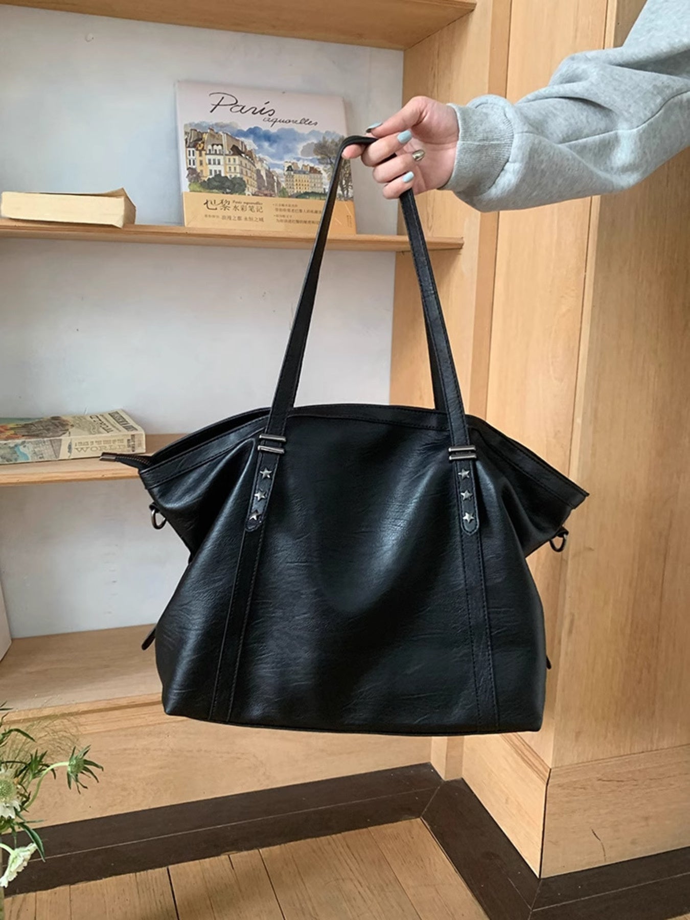 Star-Embellished Leather Shoulder Bag in black PU with dual straps.