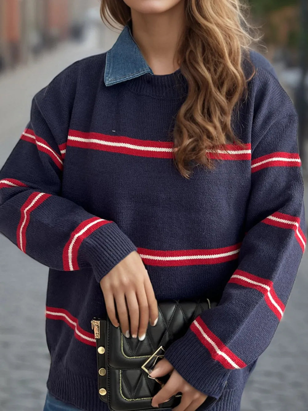 Dark blue round-neck sweater with red and white horizontal stripes and ribbed cuffs
