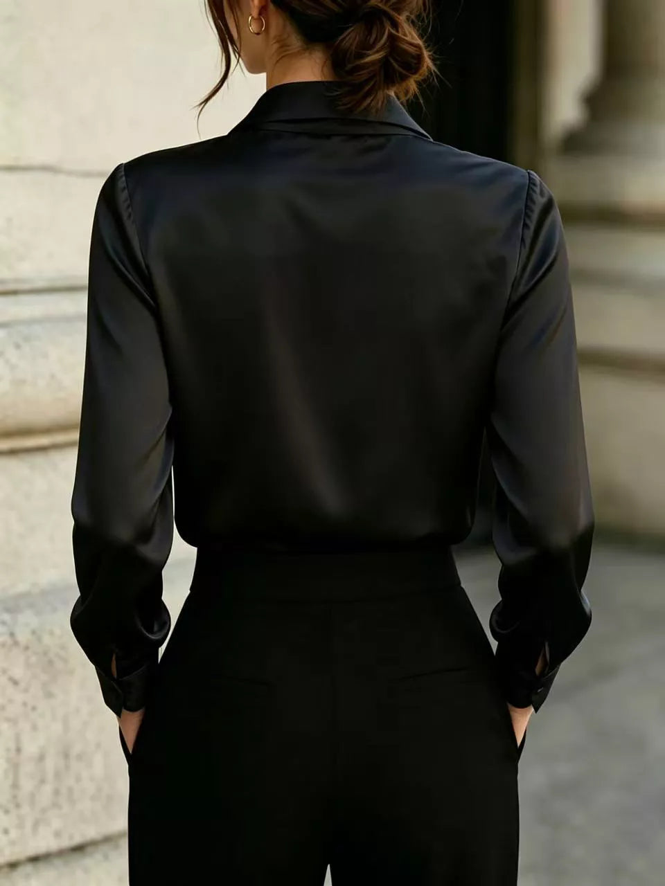 Black satin blouse with back collar, long sleeves, and fitted waist seams