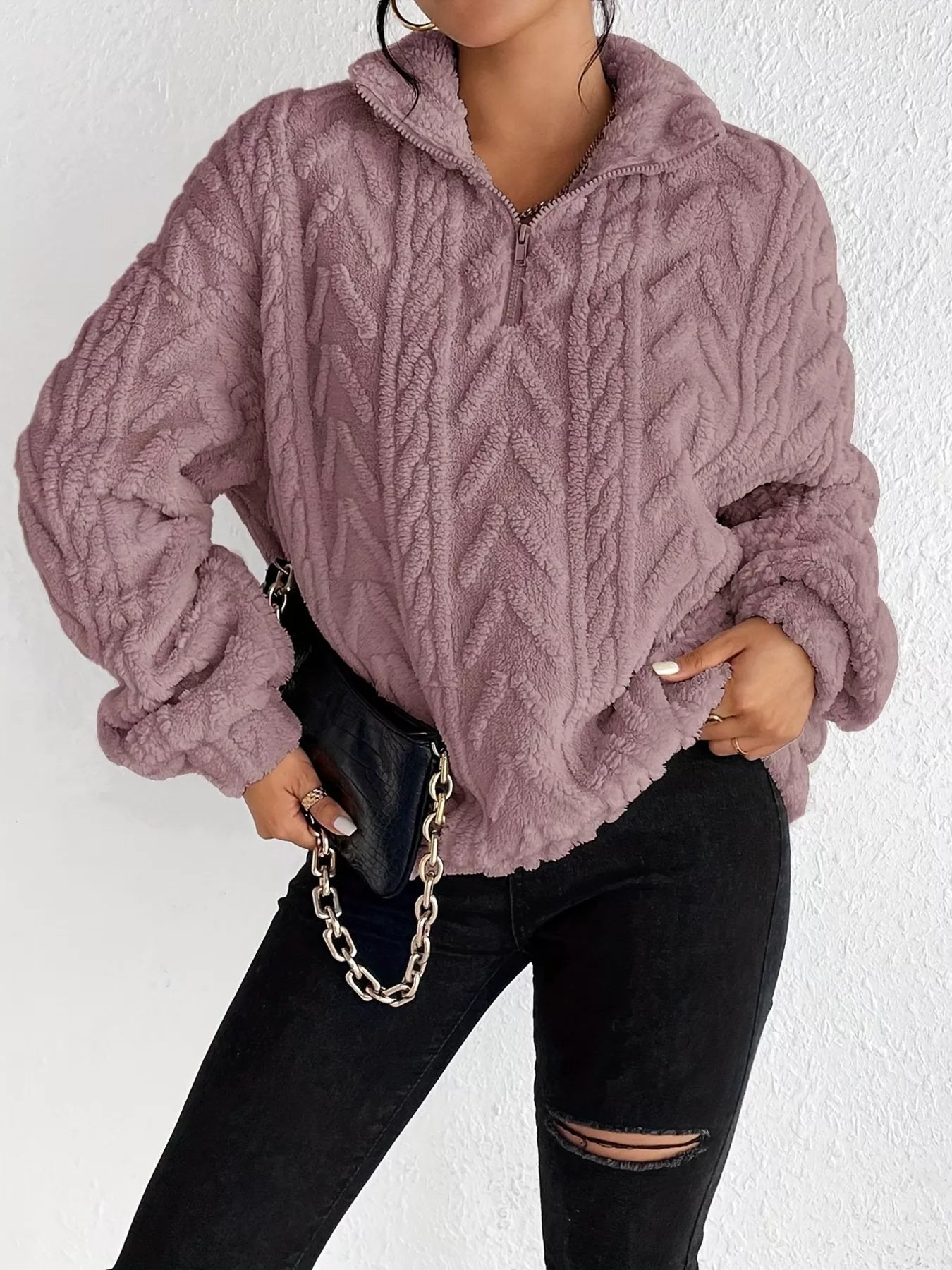 Light purple sherpa quarter-zip sweatshirt with cable knit pattern and dropped sleeves