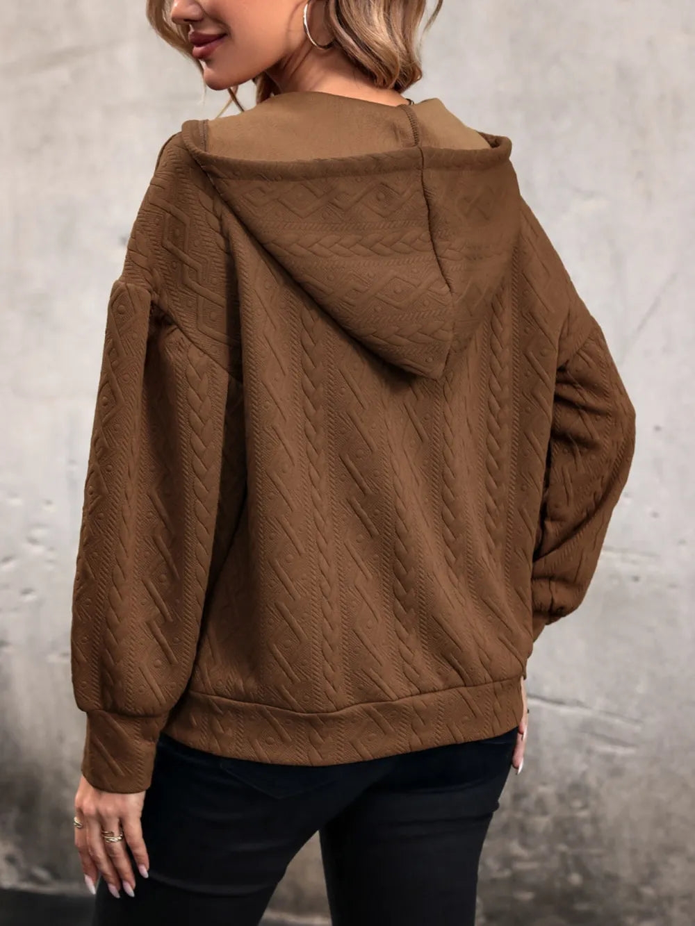 Brown back-draped drawstring hoodie with textured hood and long sleeves
