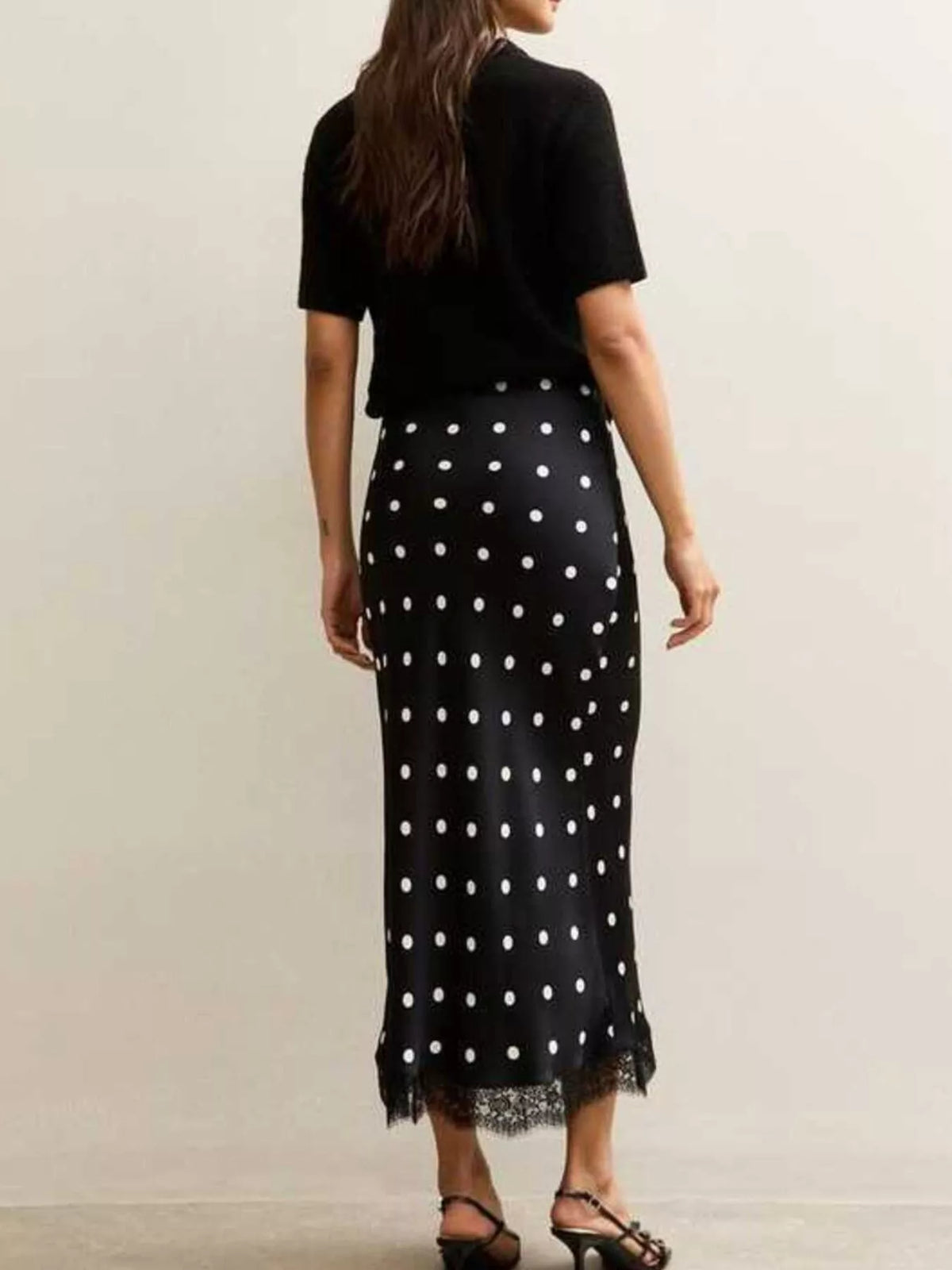Black midi skirt with white polka dots and lace hem detail