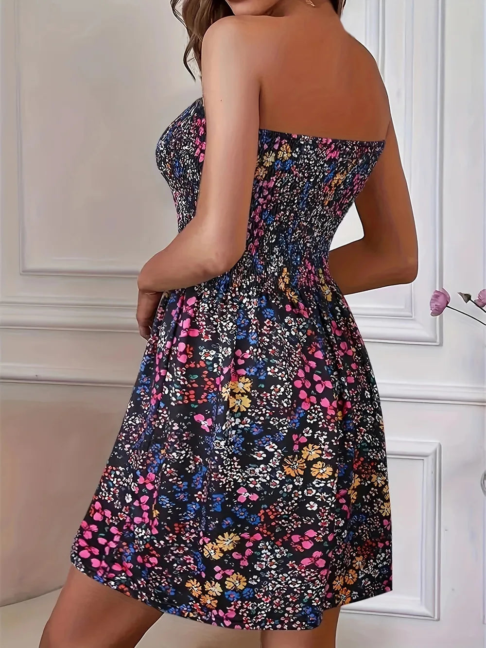 Full Size Smocked Printed Tube Mini Dress by Trendsi; black floral print, strapless smocked bodice, knee-length.