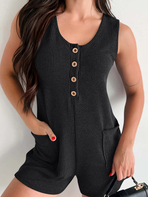 Black wide-strap romper with front buttons and side pockets, scoop neckline