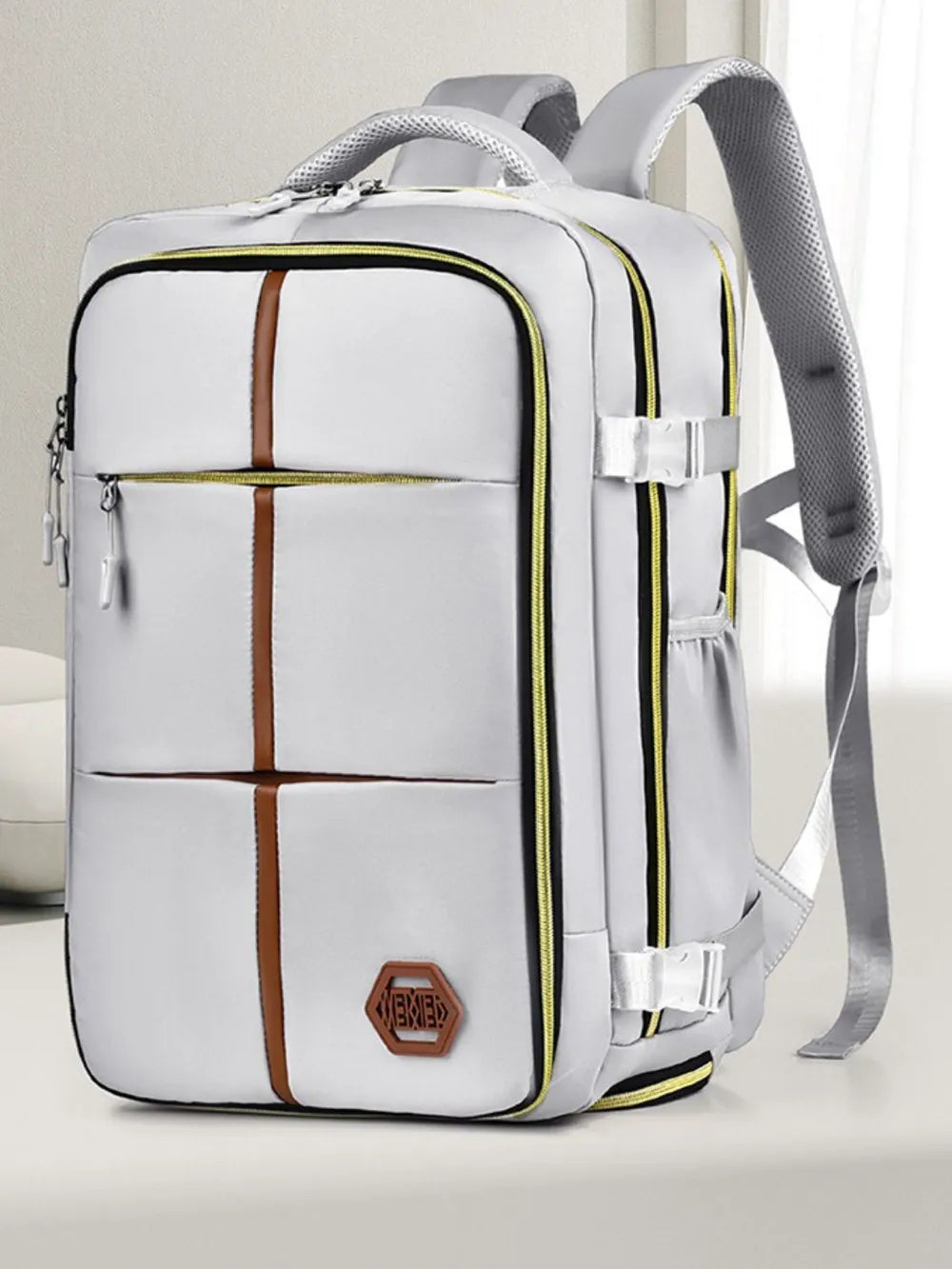 Light gray multifunction backpack bag with brown grid stripe, front zip pockets, side straps
