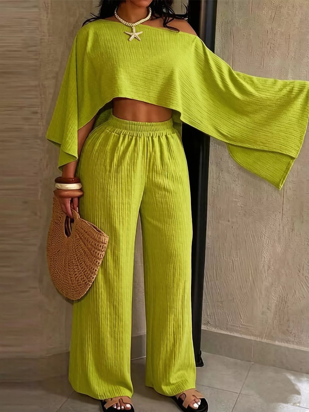 Bright green boat-neck crop top and wide-leg pants set with elastic waist and draped sleeve