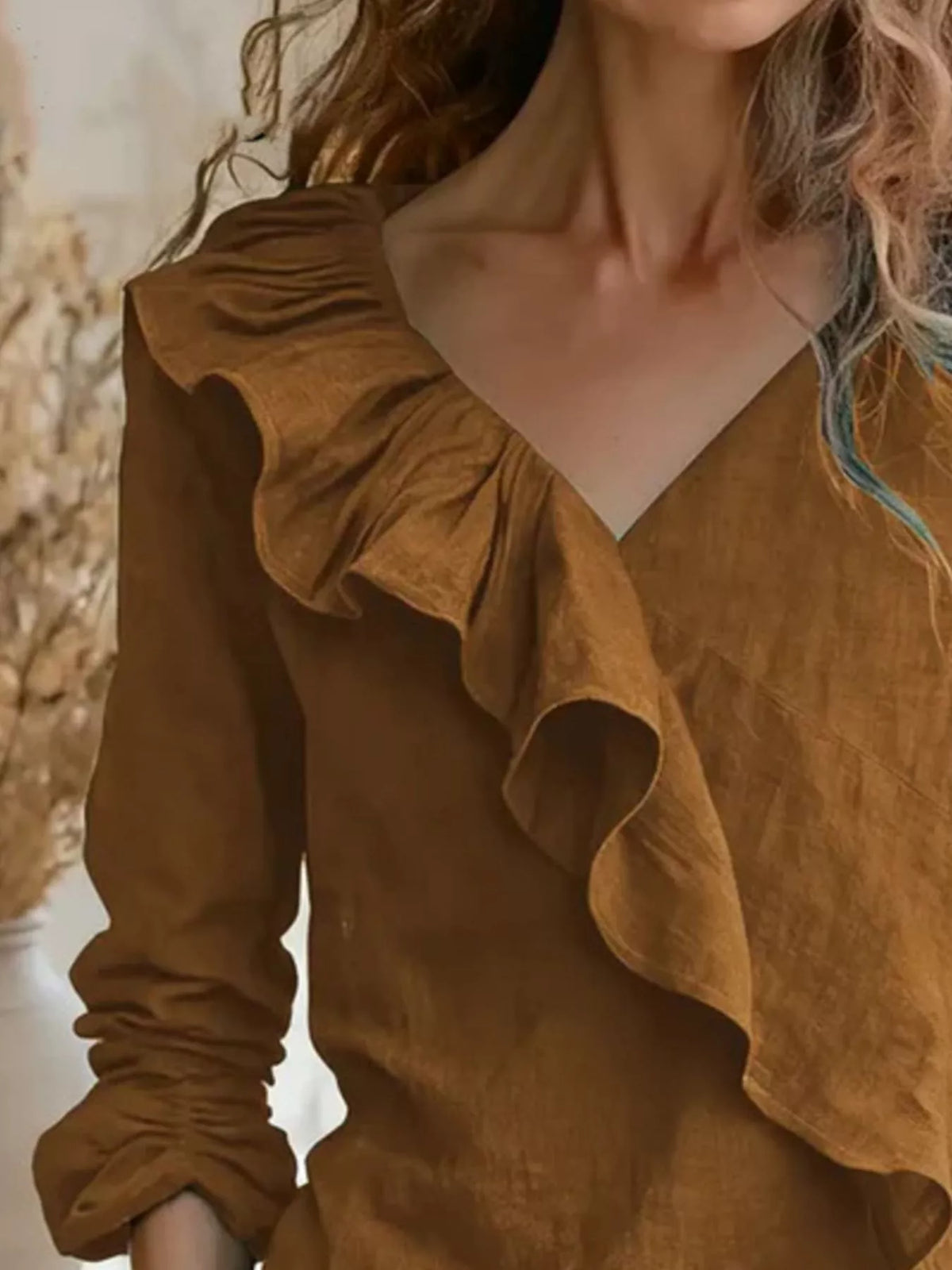 Caramel ruffled V-neck blouse with long sleeves and layered ruffle front