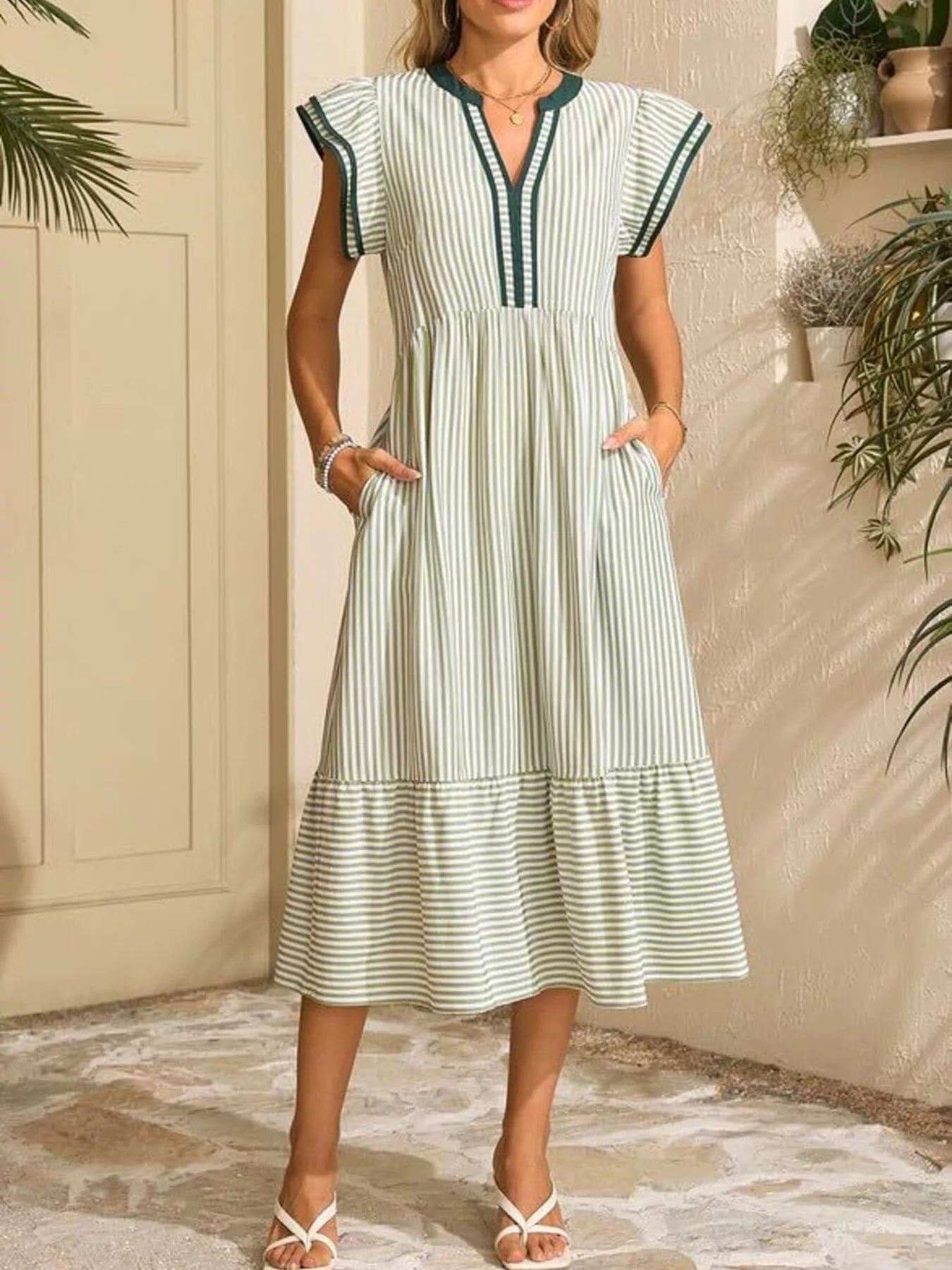 Striped Notched Ruffle Sleeve Dress with pockets in green and white.