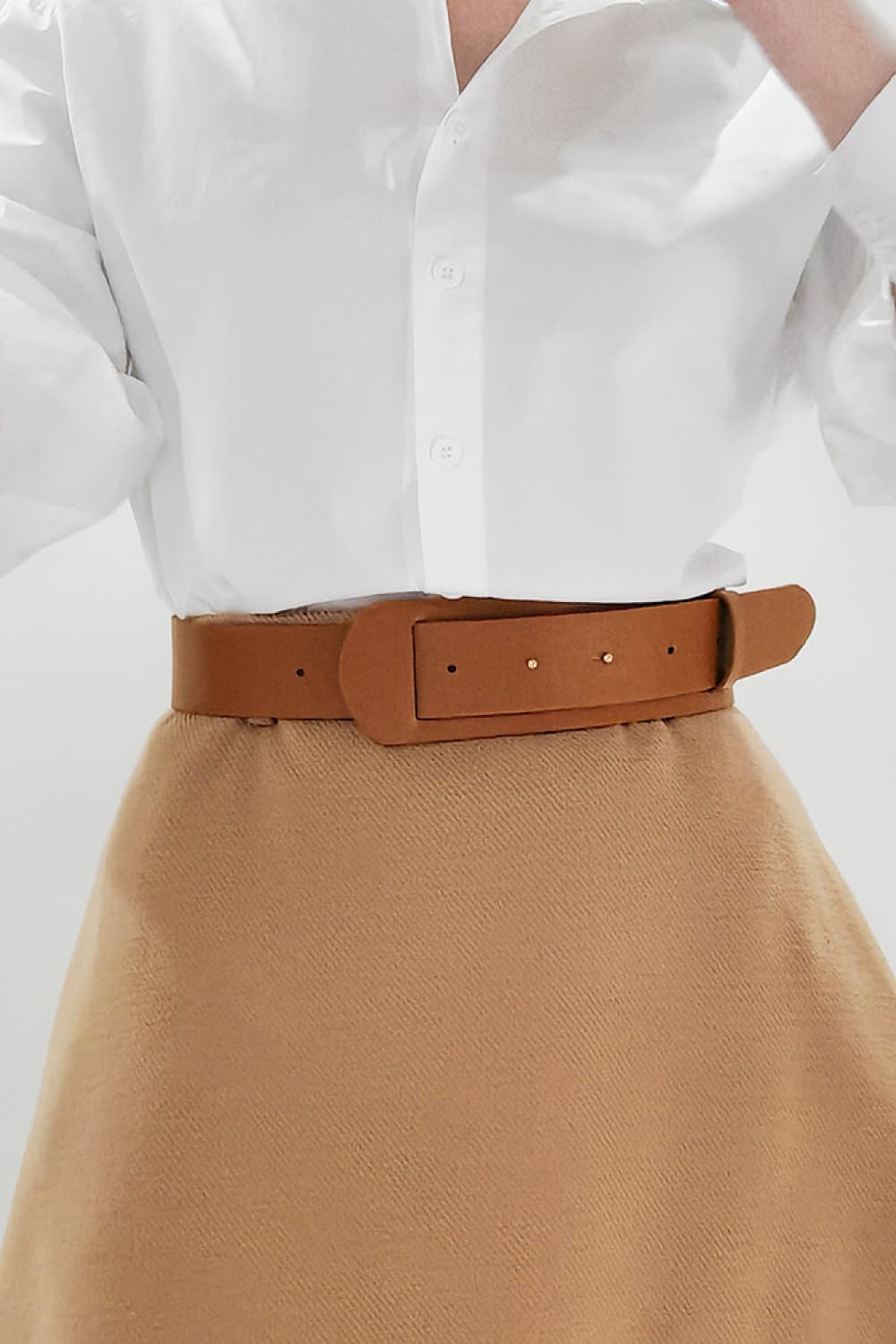 Vegan leather belt in caramel brown, wide strap with rectangular buckle plate and pin holes