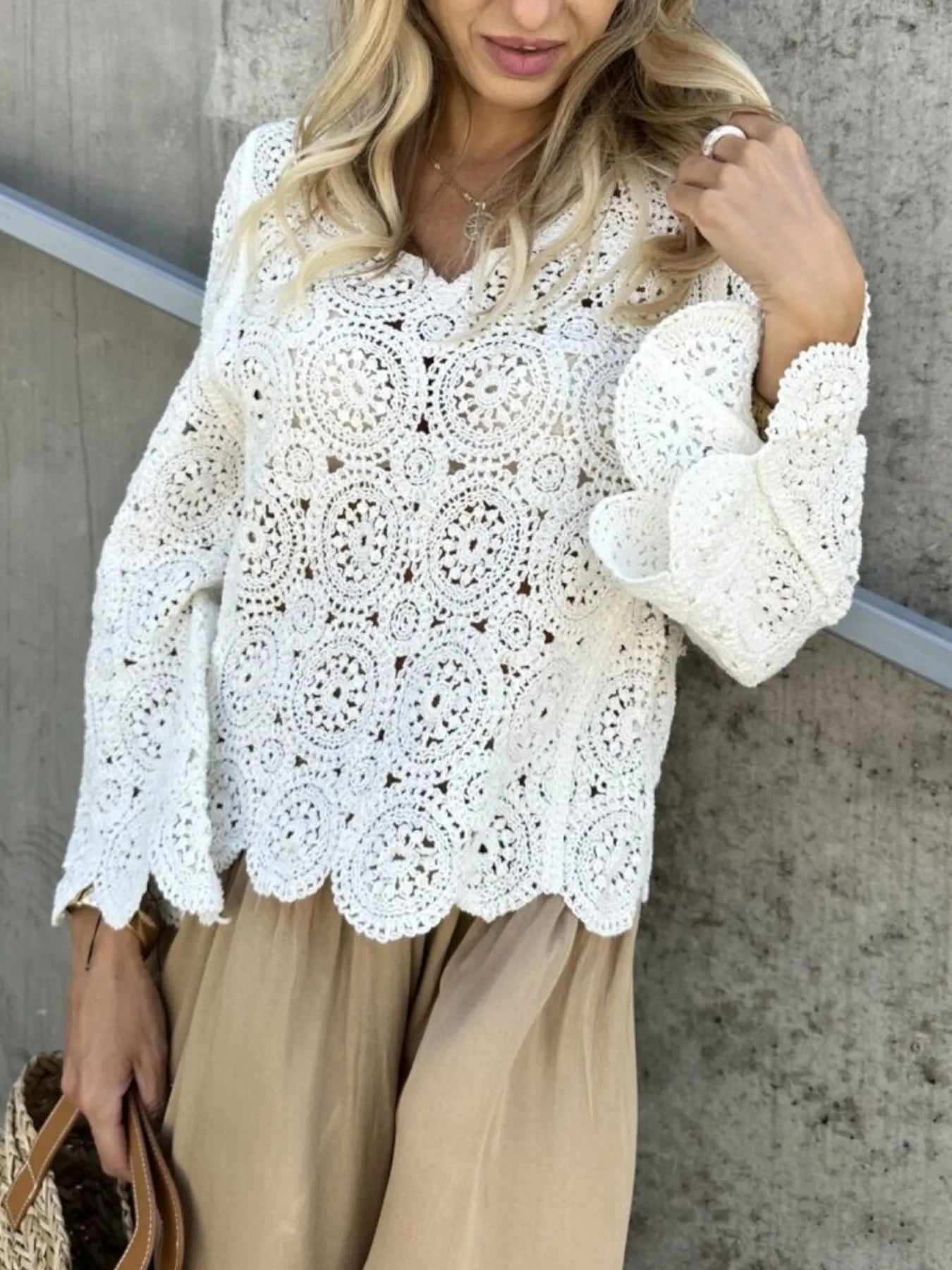 White crochet lace knit top with V-neck and circular motif front, long bell sleeves