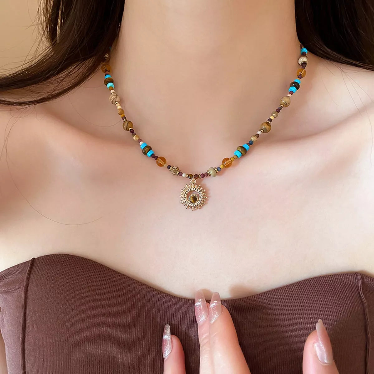 Beaded sunflower pendant necklace with multicolor beads and gold-tone round charm