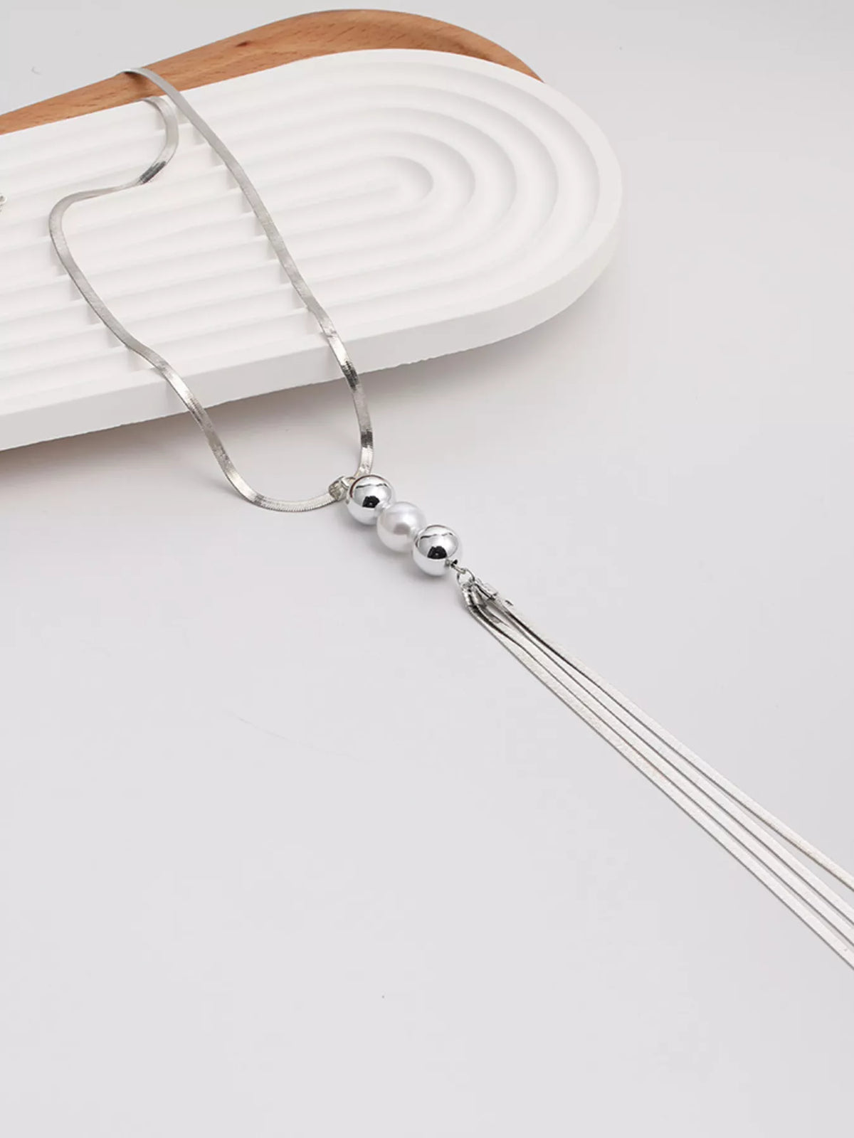 Silver bead tassel necklace with round beads and triple-line tassel