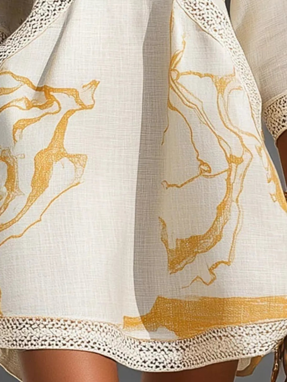 White mini dress fabric with gold abstract print and lace-trim hem edge