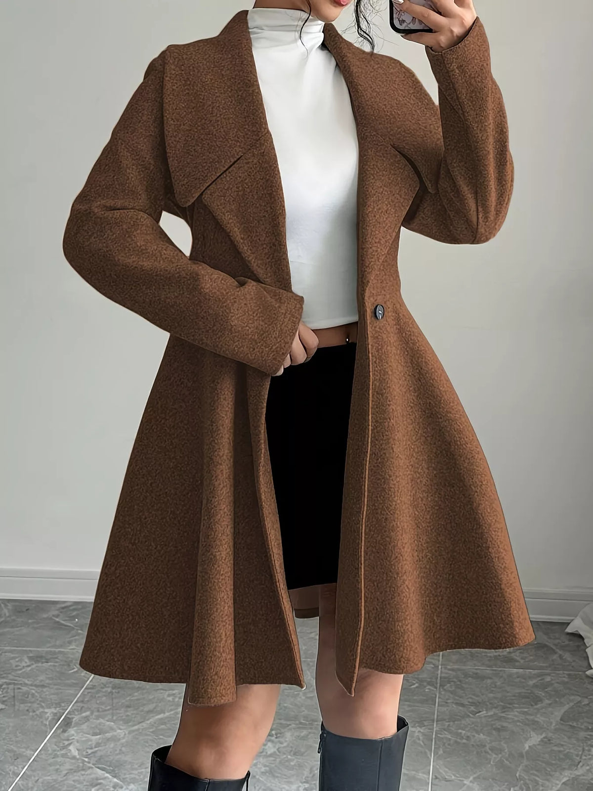 Brown double-breasted long-sleeve trench coat with notched lapels and button front