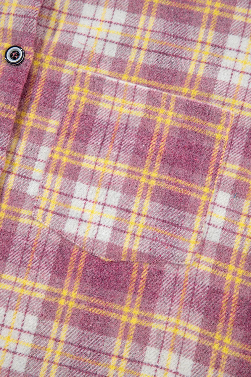 Pink plaid shacket chest pocket and button detail close-up