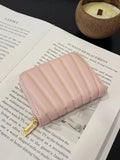 Blush pink mini vegan leather wallet with quilted front and gold zipper