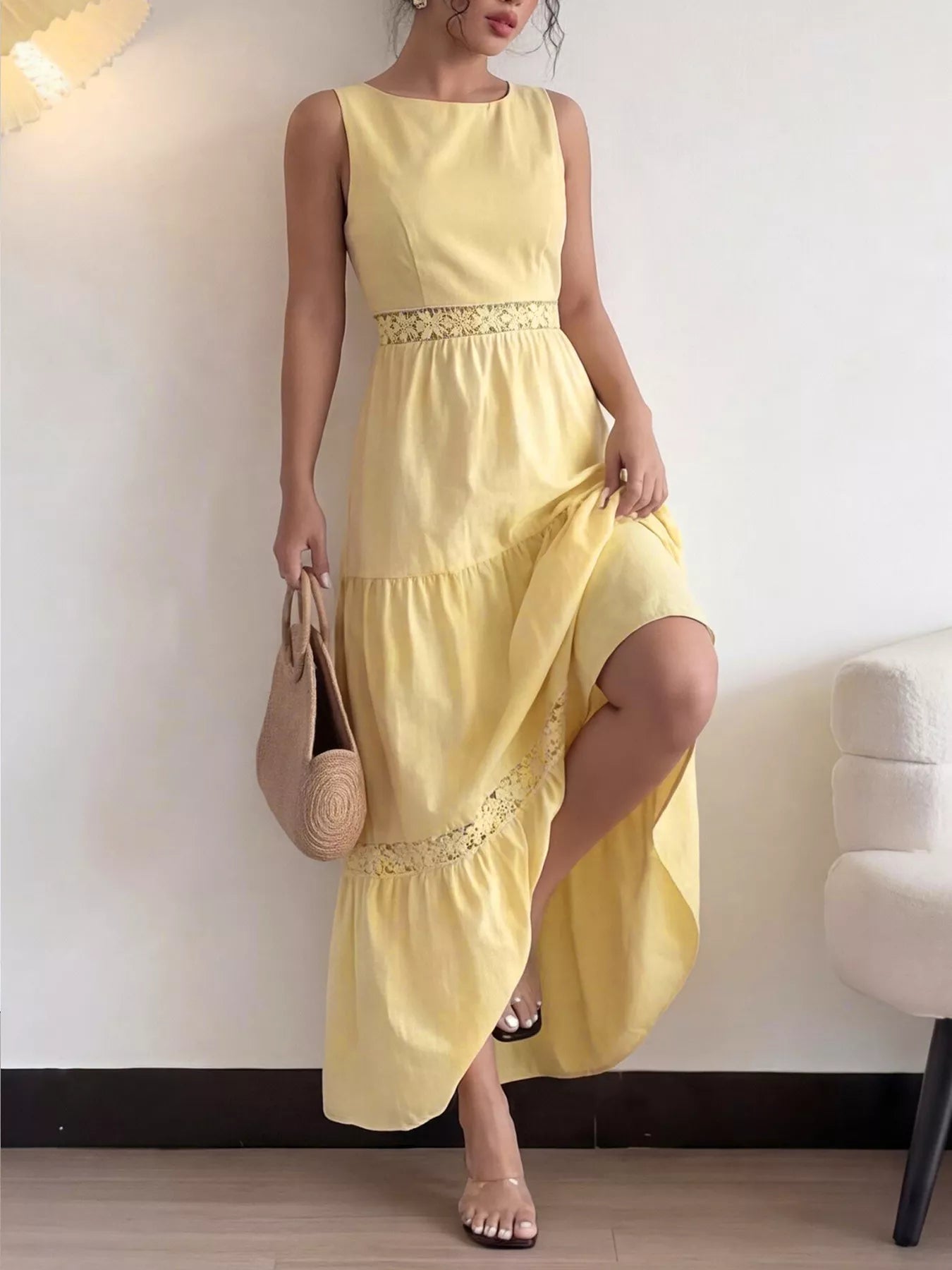 Yellow sleeveless tiered maxi dress with lace trim at waist and hem