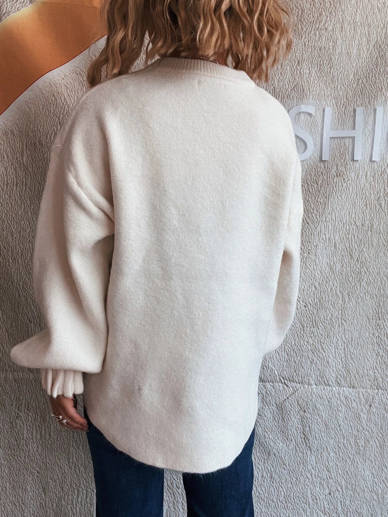 White back view dropped shoulder sweater with round neck and ribbed sleeve cuffs