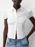 White puff sleeve fitted shirt with button front, pointed collar, and side bust seams