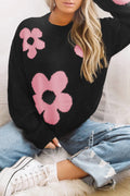 Black long-sleeve sweater with pink floral pattern and round neckline