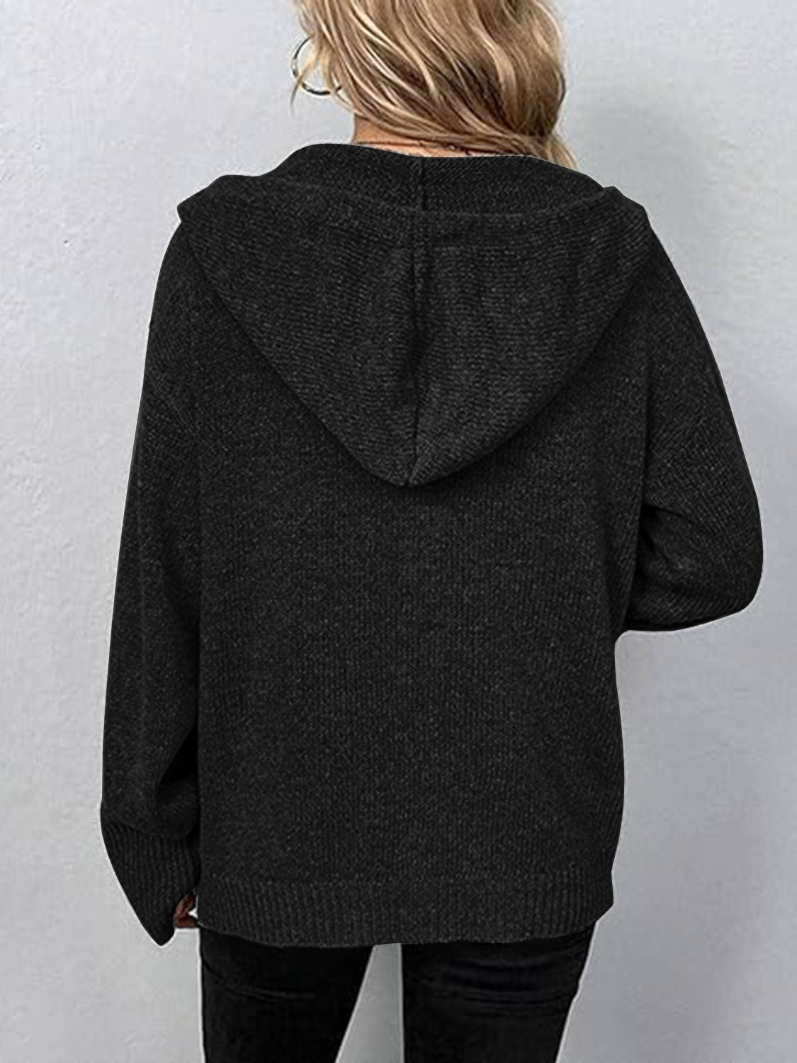 Black hooded button cardigan, back view with attached hood and long sleeves