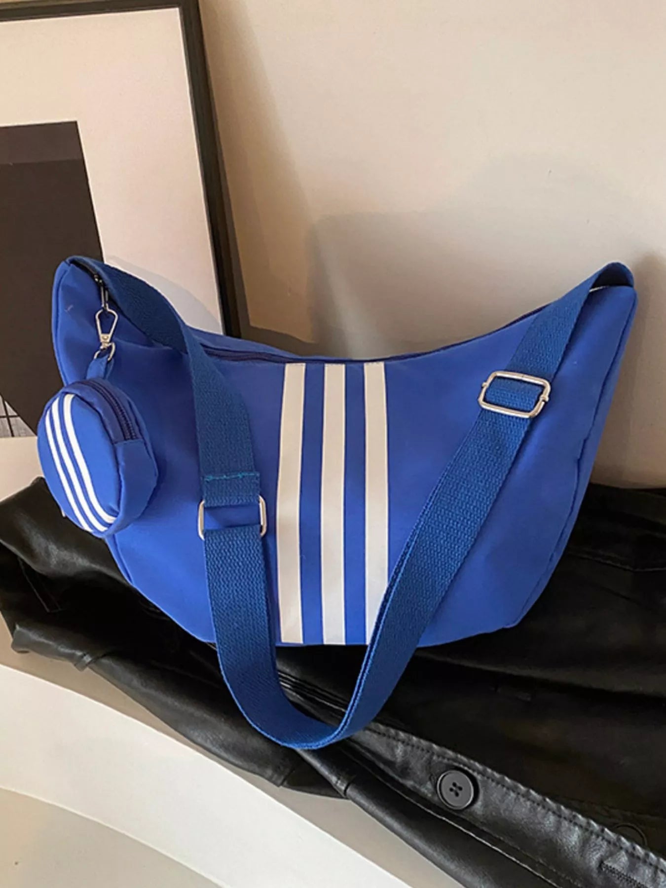 Striped blue crossbody bag with coin purse and adjustable strap