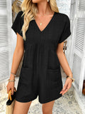 Black V-neck short-sleeve romper with front pockets and elastic waist seams