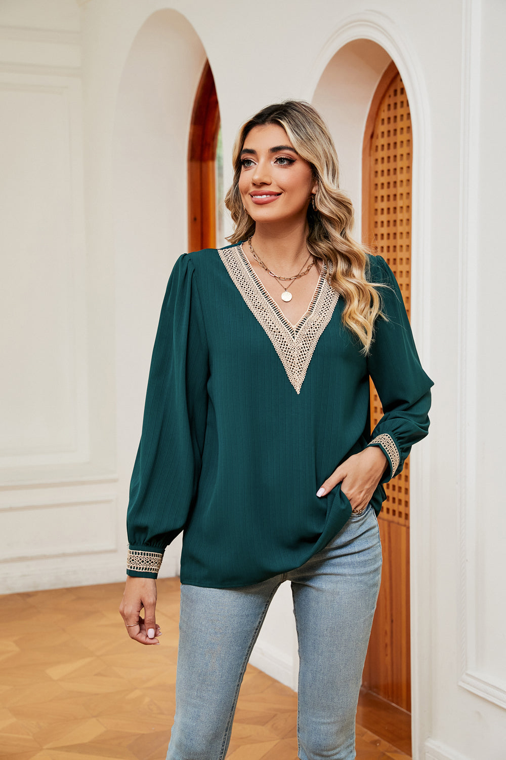 Green blouse with contrast V-neck trim and long puff sleeves, relaxed fit