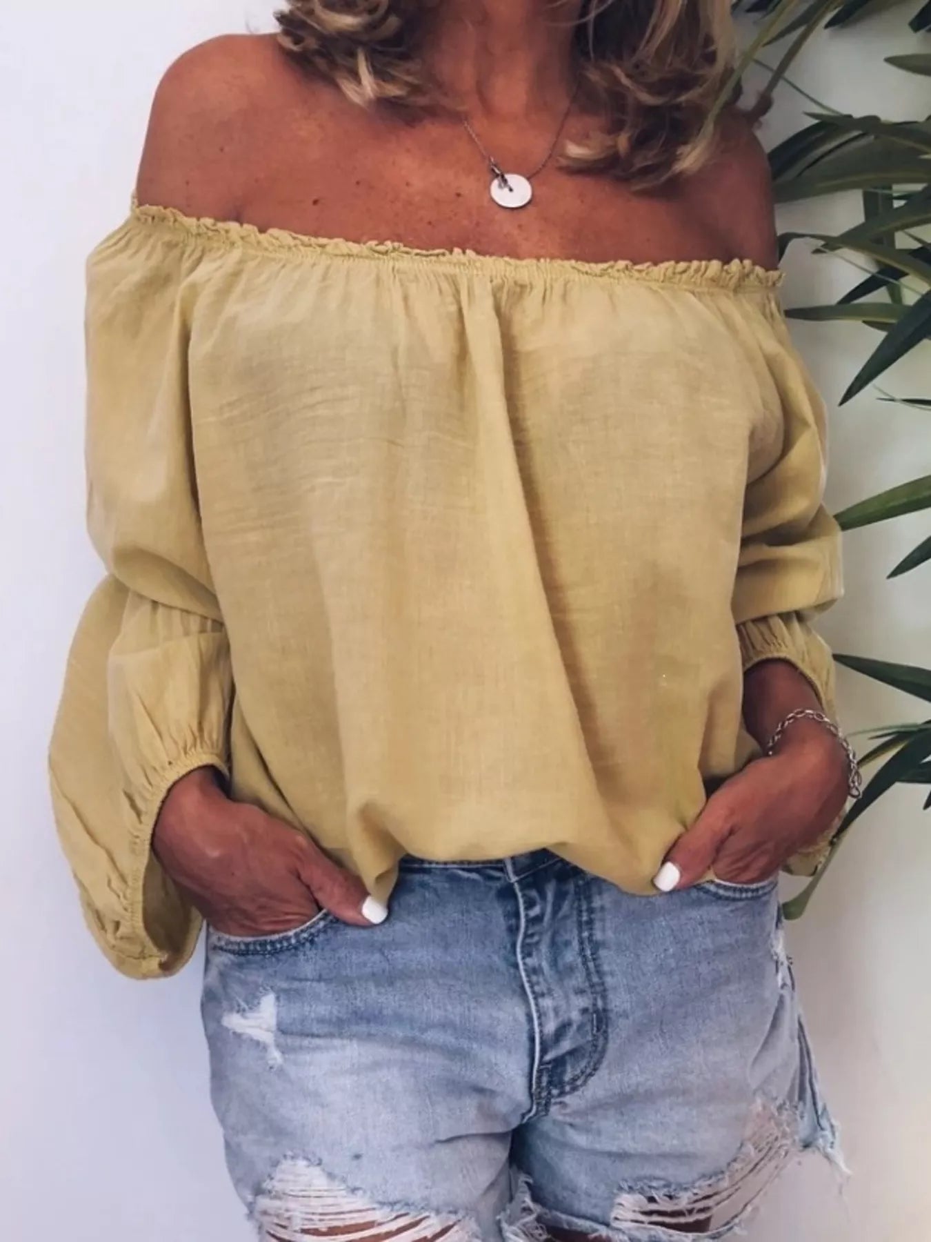 Off-shoulder frill-trim blouse in light olive, gathered elastic neckline, long puff sleeves