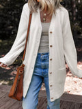 White fuzzy cardigan with button front and side pockets, long sleeves