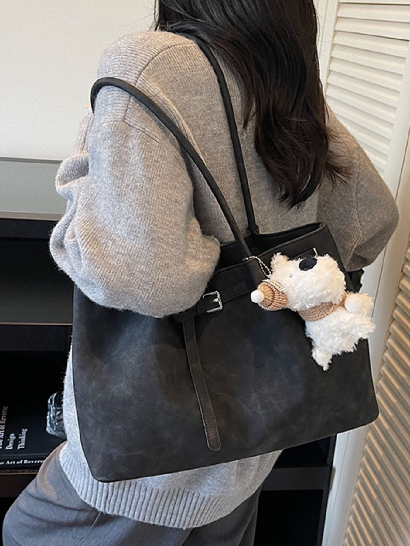 Buckle Detail Shoulder Bag in black PU with adjustable strap and teddy bear keychain