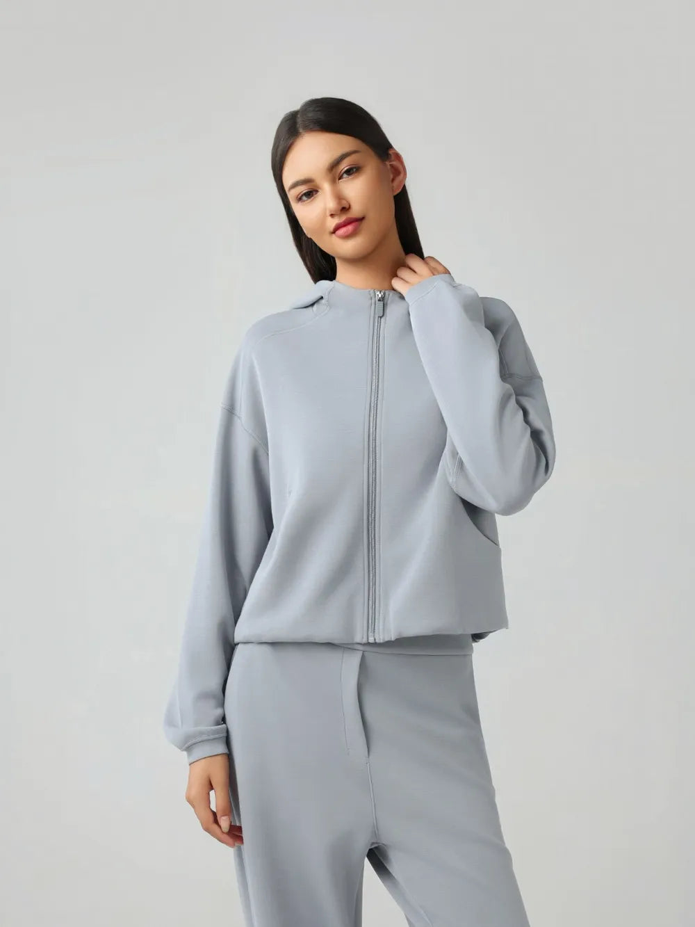 Light blue zip-up active hoodie with hood and full front zipper, front view