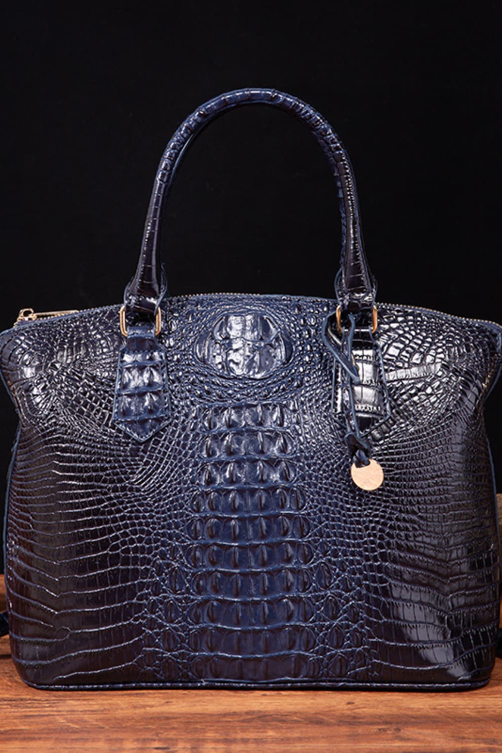 Vegan leather handbag in dark blue with top handles and embossed crocodile texture