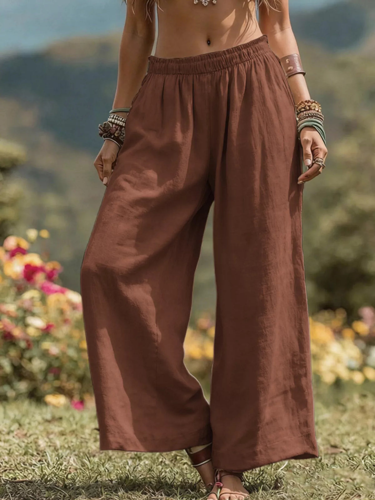 Rust brown bohemian wide-leg pants with elastic waistband and loose, flowing legs