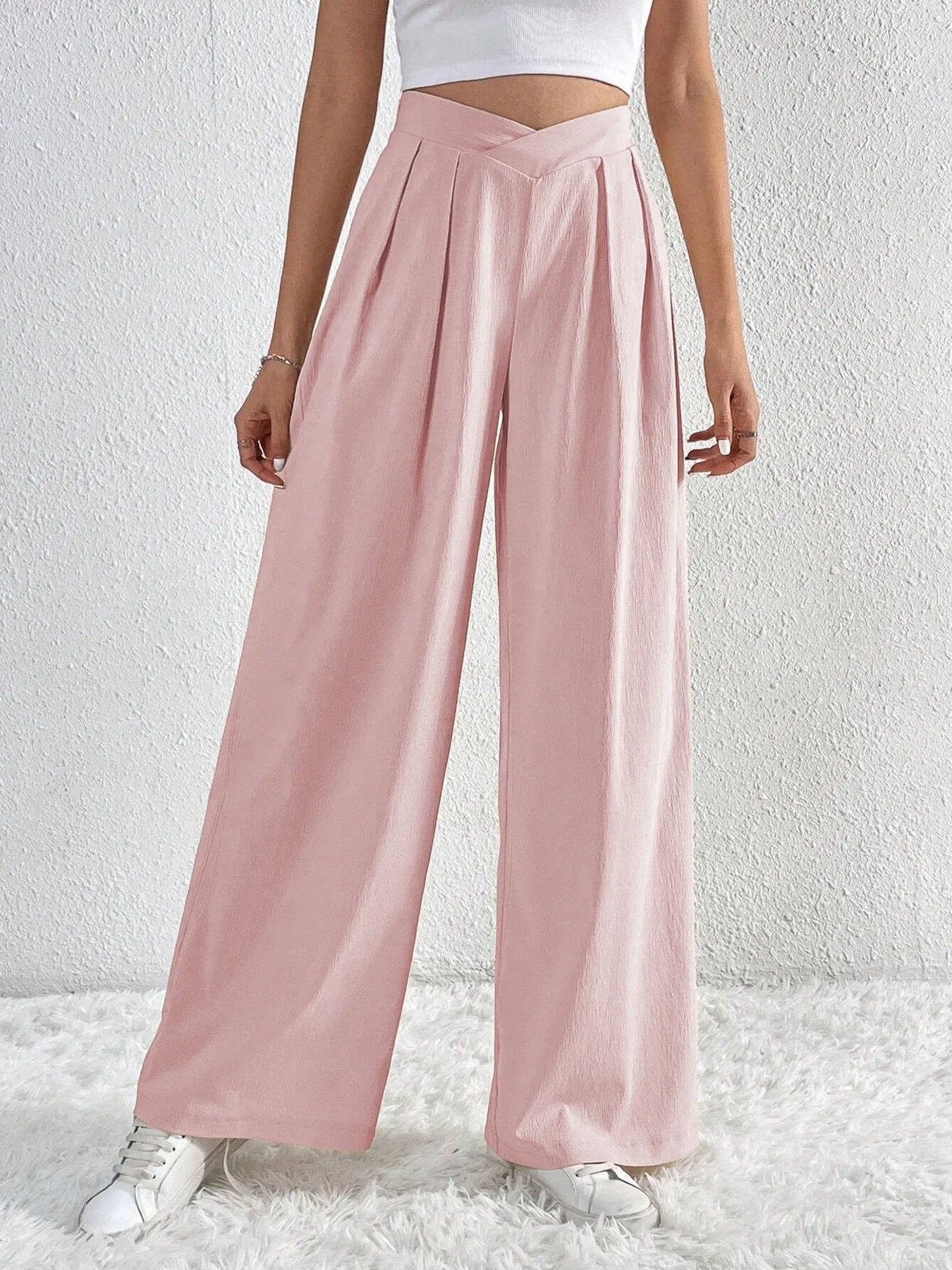 Dusty pink wide-leg pants with ruched front V-waist and flowing legs