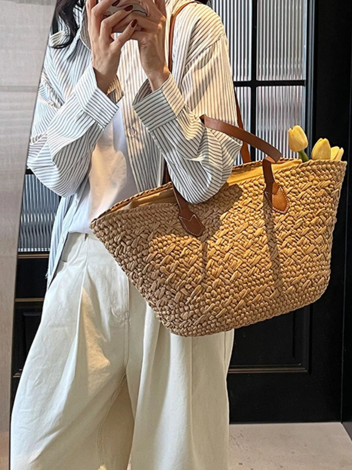 Caramel woven tote shoulder bag with brown leather shoulder straps and top edge